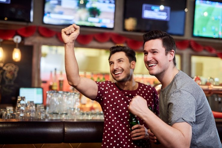 Live football and casino games displayed on smartphone screen